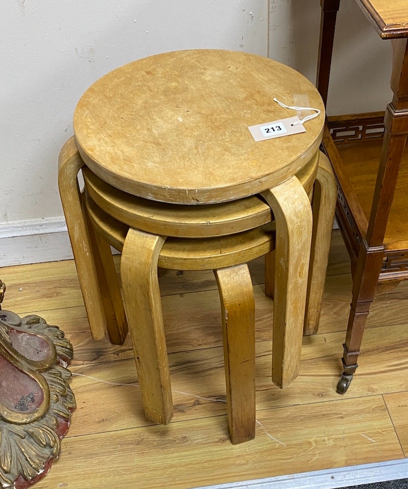 Alvar Aalto for Finmar, three mid century bentwood and ply stools, seat diameter 34cm, height 44cm